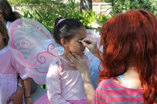 Hire a teenager to dress up and run a makeup and hair station. 